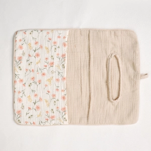 Detail of floral cotton baby crib organizer with oval dispenser opening for tissue