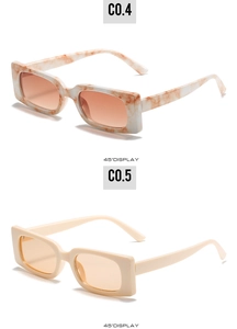 Detail view of marble and beige rectangular sunglasses with orange lenses at 45 degree angle