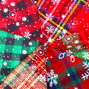 Christmas dog bandanas with red green plaid patterns and white snowflake prints