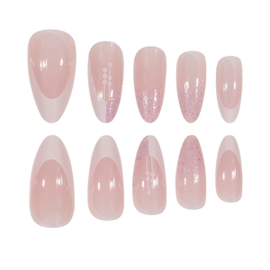 French almond press-on nails with pink glitter gradient and geometric designs