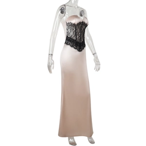 Close-up of champagne satin gown showing intricate black lace waist corset detail