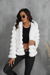 Detail of white faux fur texture and hooded design on a thick winter jacket for women