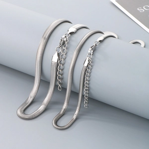 Detailed view of silver flat snake chain texture with secure lobster clasp and extension