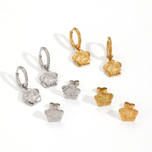 Floral titanium steel earrings set in gold and silver finish on white background