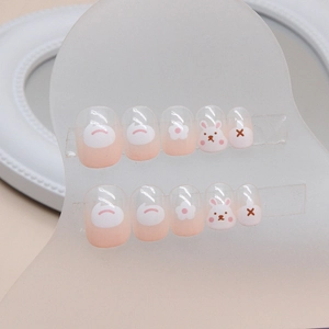 Cute pink gradient press-on nails for kids with rabbit and flower patterns