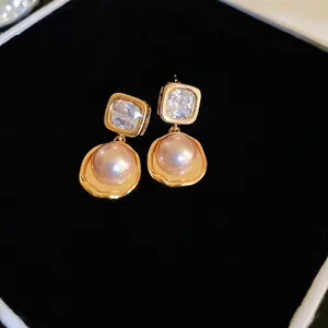 Elegant 18k gold plated earrings featuring square zircon and round pink pearls
