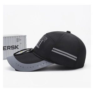 Close-up of quick-dry fishing hat with reflective strips and side typography detail