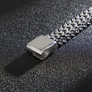 Macro shot of stainless steel dragon scale bracelet with magnetic square clasp closure
