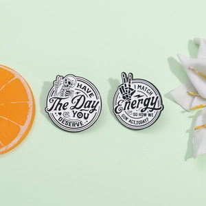 Cartoon skeleton enamel pins with Have The Day You Deserve and I Match Energy text
