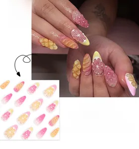 Détail du relief 3D citron et orange sur capsules d'ongles amande style français rose et jaune