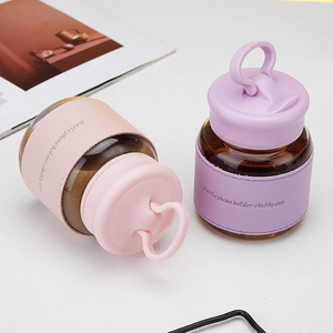Pink and purple chubby glass cups with silicone lids and phone holder sleeves