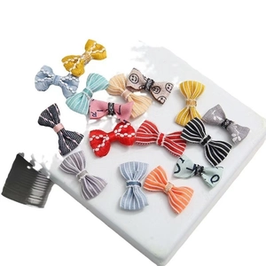 Set of 15 colorful striped and plaid fabric bow ties for DIY crafts and doll accessories