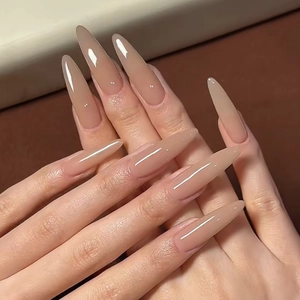 Elegant long almond press-on nails in natural nude pink finish with high gloss shine