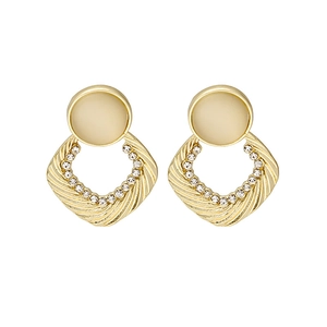 Elegant gold earrings with cat eye stones and diamond accents in a geometric design
