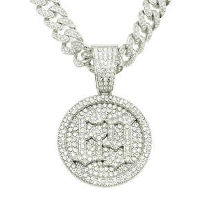 Macro shot of silver iced-out Cuban chain and round pendant with number 69 detail