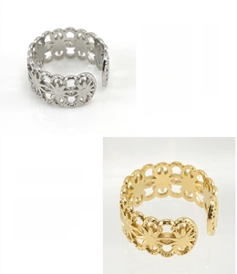 Detail of adjustable hollow flower rings in 18K gold plated and steel finish