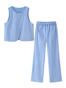 Detail view of blue striped sleeveless vest with irregular button closure and matching pants