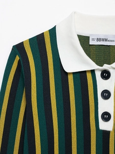 Close-up of a striped knit polo shirt featuring a white collar and black round buttons