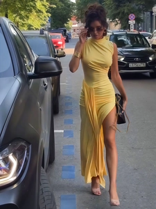 Elegant yellow sleeveless high neck dress with side ruching and front slit detail