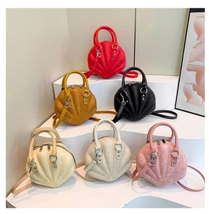 Detail of shell-shaped handbags with floral embossing in six stylish colors