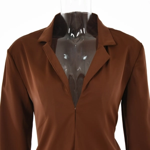 Detailed view of a brown deep V-neck buttoned cardigan top on a clear mannequin