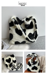 Detail view of plush black and white heart tote bag with soft faux fur texture