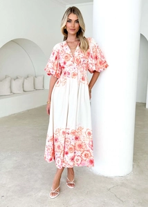 Close-up of V-neck floral midi dress with puff sleeves and elegant waist design