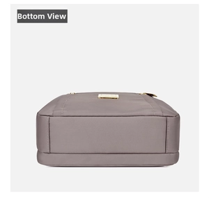 Detailed bottom view of a nylon shoulder bag showing reinforced stitching and fabric texture