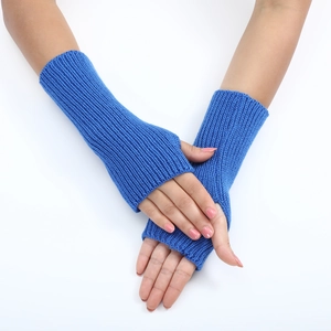 Close-up of blue ribbed knit fingerless gloves with soft texture and open thumb