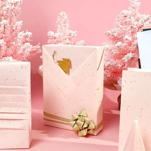Pink gold foil gift wrapping paper set with decorative gold bows for Valentine gifts