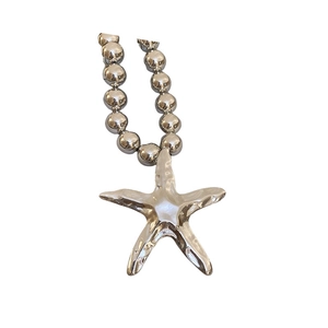 Polished silver starfish pendant on a minimalist metal ball chain necklace for women