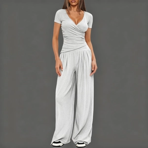 Close-up of light grey short sleeve V-neck top and high waist wide leg pants set