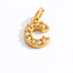 Detailed view of an 18K gold letter C pendant featuring sparkling clear zircon stones