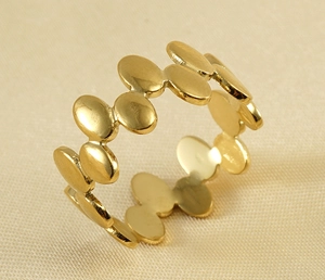 Detailed macro view of 18k gold geometric irregular open ring with polished hollow finish