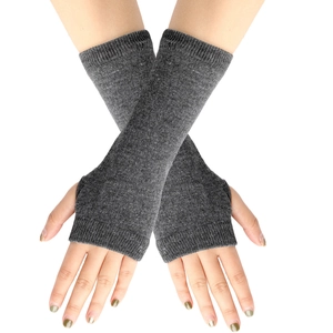 Close-up of grey knitted fingerless gloves showing striped texture and crossed hand pose