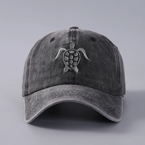 Macro shot showing detailed turtle embroidery on washed cotton canvas baseball cap