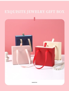 Detailed view of colorful drawer jewelry gift boxes with elegant silk ribbon handles