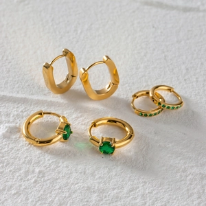 Three pairs of gold stainless steel earrings featuring sparkling green zircon accents
