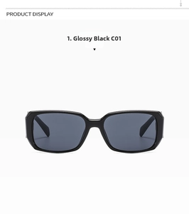 Detail view of shiny black rectangular sunglasses frame with dark grey lenses