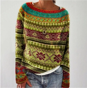 Detail of multi-color ethnic style sweater showing green red teal vintage jacquard knit pattern