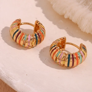 Macro shot of 18K gold plated hoop earrings with multi-colored striped enamel finish
