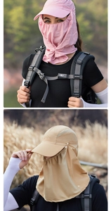 Detail of pink and khaki sun hats with breathable mesh face masks for outdoor hiking