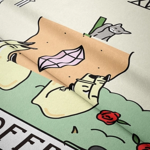 Close-up of soft flannel tapestry fabric showing cute cat and toast cartoon printing