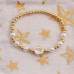 Perlenarmband in Gold und Weiß mit rundem Fé-Glaubensanhänger aus weißem Emaille