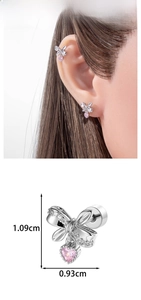 Detail of silver bow cartilage piercing with pink heart pendant and dimensions