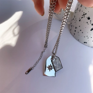 Silver cuban chain necklace with star-engraved pendant and marble inlay shell charm