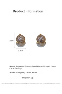 Macro shot of gold plated earrings featuring cubic zirconia spheres and mermaid pearls