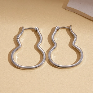 Silver hollow gourd earrings with polished metal finish in minimalist style
