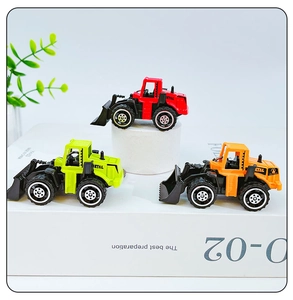 Three alloy construction toy car keychains in red, green, and orange on white props