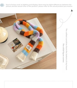 Detail of colorful striped knitted scarf with woven label and soft mohair texture